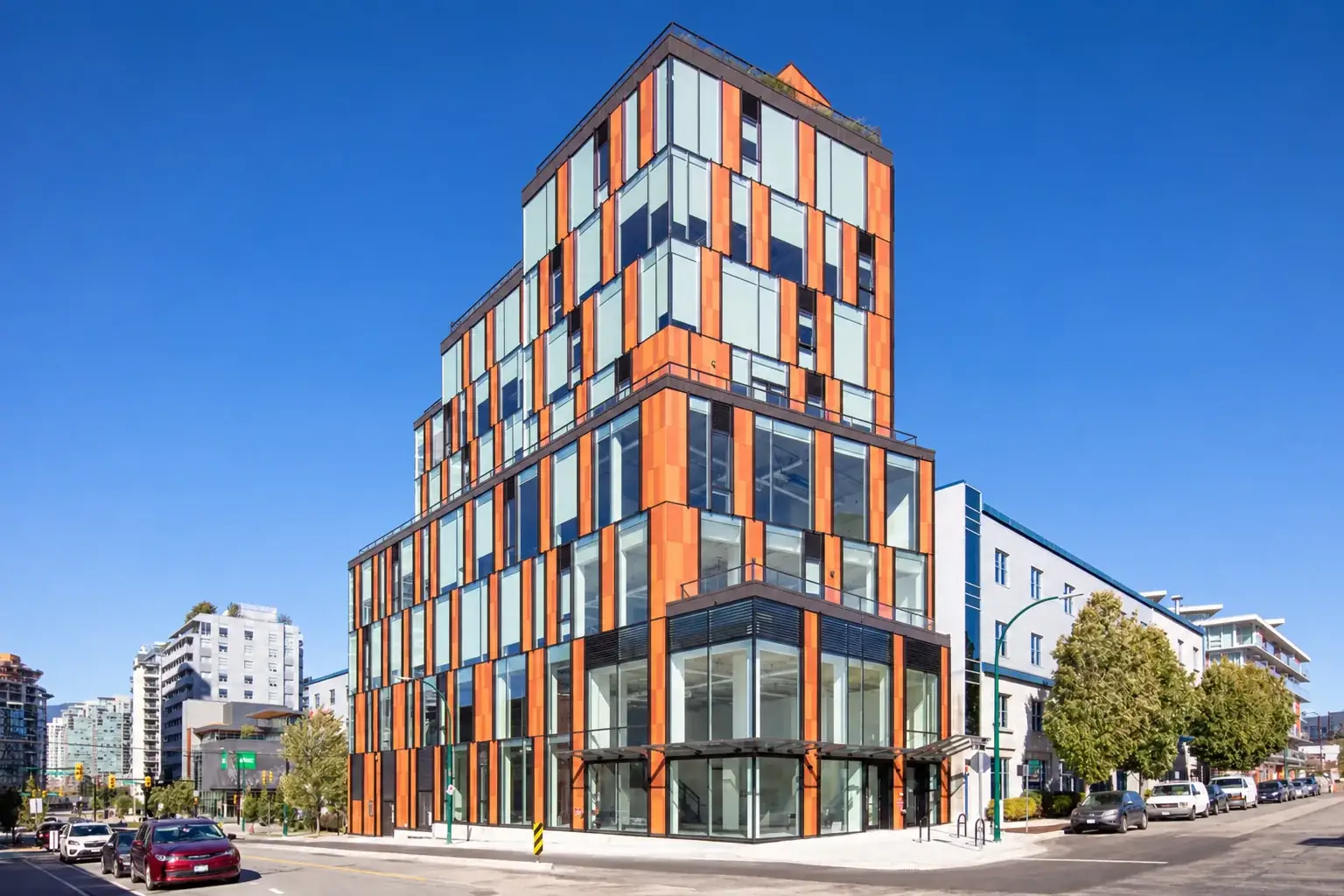 AI rendering of the building at 107 E 3rd Ave by day; Another Studios is the glass corner on the ground floor