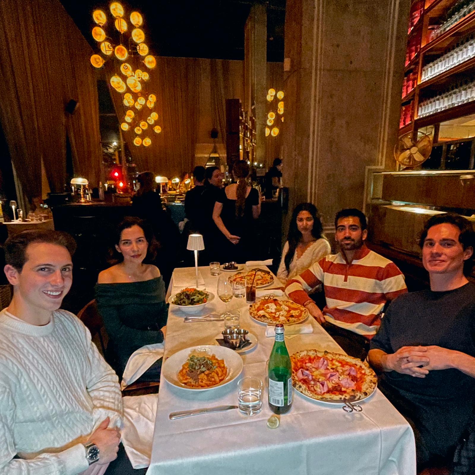 People at a Founder Feast dinner table in a Vancouver restaurant